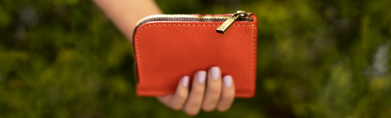 Hand Holding A Leather Accessory