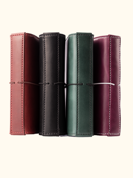 Different colors and models of the Austen Number 5 Travelers Notebook and Bookcover
