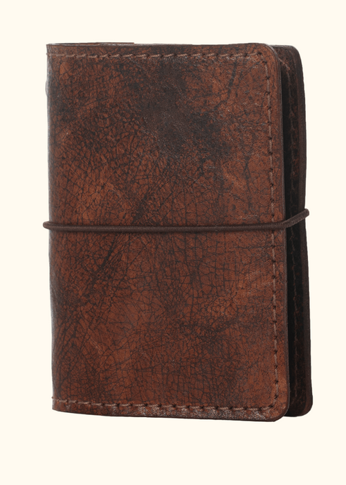 Brown leather nano notebook cover. Small leather journal cover with elastic closure.