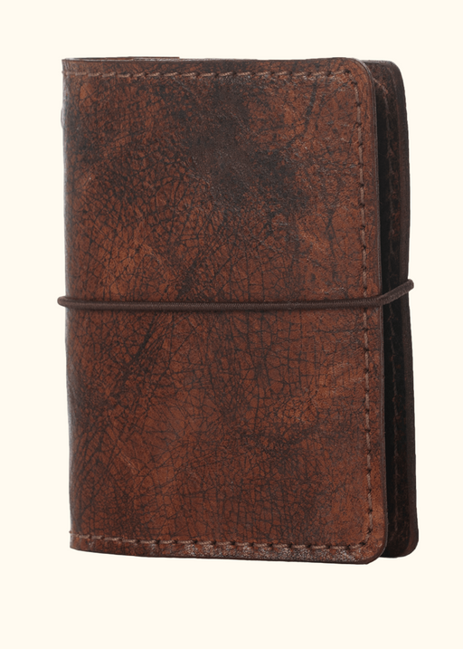 Brown leather nano notebook cover. Small leather journal cover with elastic closure.