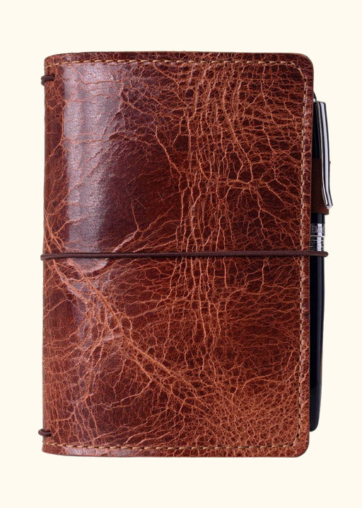 Brown leather travelers notebook cover. Brown leather journal cover with elastic closure.