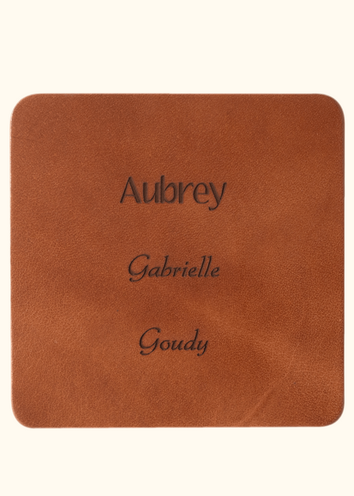 Brown leather sample with inscription text. Choose from 3 different fonts to customize the leather notebook cover.