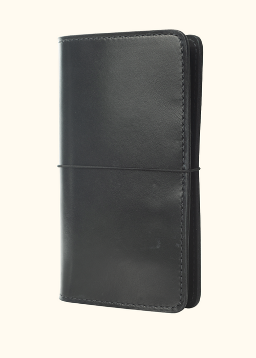 An Austen leather folio with a closure elastic. The collection name is Austen and the color is called Morland (Ebony Black) - ChicSparrow