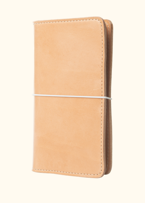 An Austen leather folio with a closure elastic. The collection name is Austen and the color is called Emma (Buff) - ChicSparrow