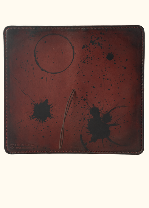 This is an example of what antiquing looks like on a Drummond. Antiquing is when an artist applies dye to make markings like splatters and cup rings on a leather notebook to make it look older. - ChicSparrow