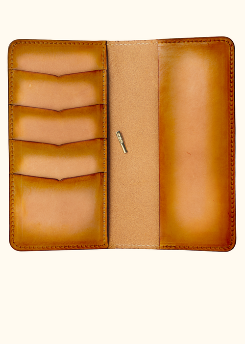 This is an example of what antiquing looks like on an Emma interior. Antiquing is when an artist applies dye to make markings like splatters and cup rings on a leather notebook to make it look older. Or darkening the edges. - ChicSparrow