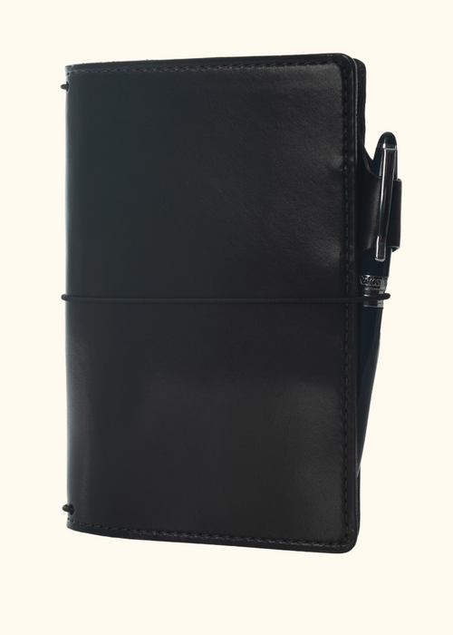 An Austen leather notebook with a closure elastic and pen loop. The collection name is Austen and the color is called Morland (Ebony Black) - ChicSparrow