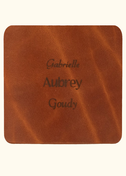 Brown leather sample with inscription text. Choose from 3 different fonts to customize the leather notebook cover.
