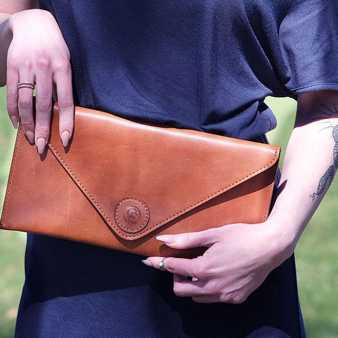 Women holding a purse.