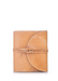 A smooth leather journal cover with a round flap and a leather strap wrapped around it.