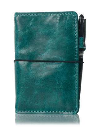 Blue leather travelers notebook journal cover with elastic closure.