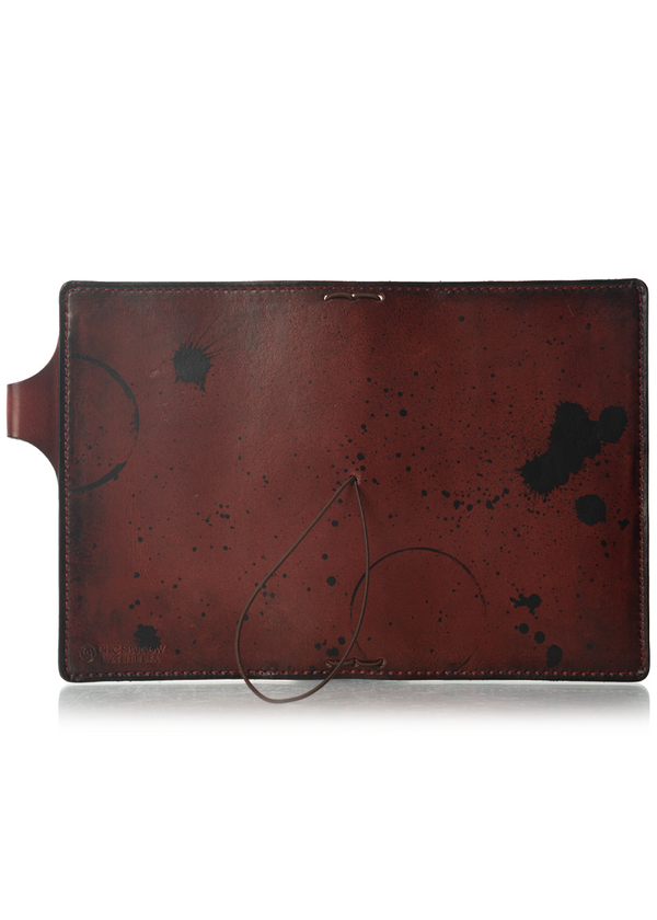This is an example of what antiquing looks like on a Drummond. Antiquing is when an artist applies dye to make markings like splatters and cup rings on a leather notebook to make it look older. - ChicSparrow