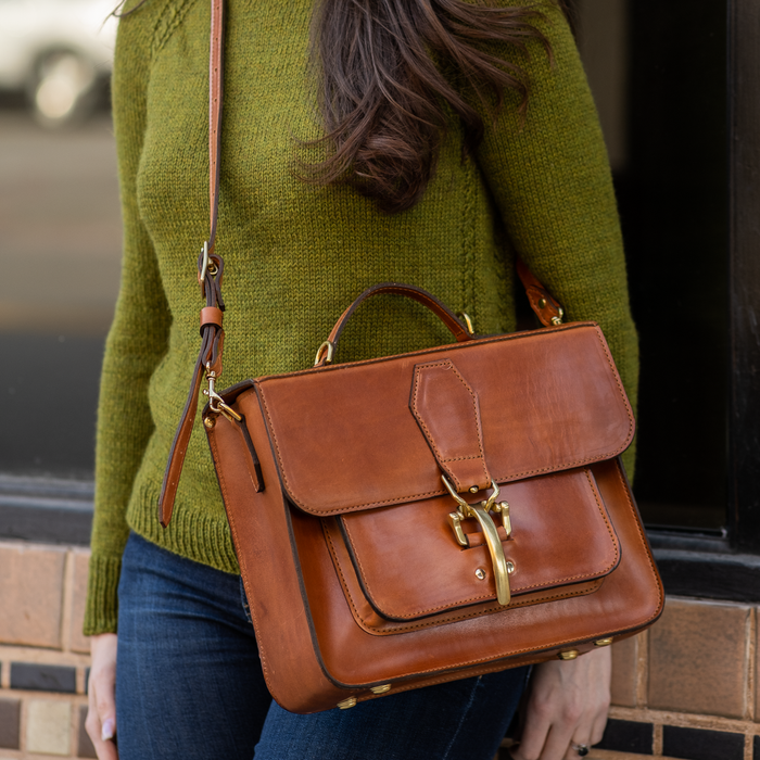  a woman in a  with a Leather satchel configured as cross body