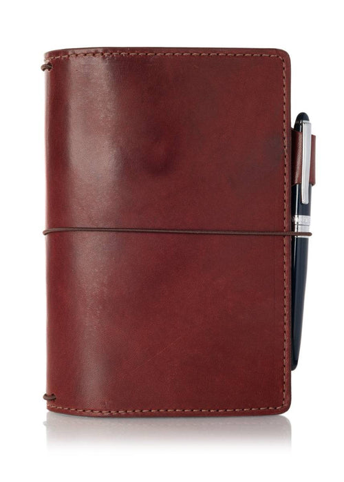 An Austen leather notebook with a closure elastic and pen loop. The collection name is Austen and the color is called Drummond (Burgundy) - ChicSparrow