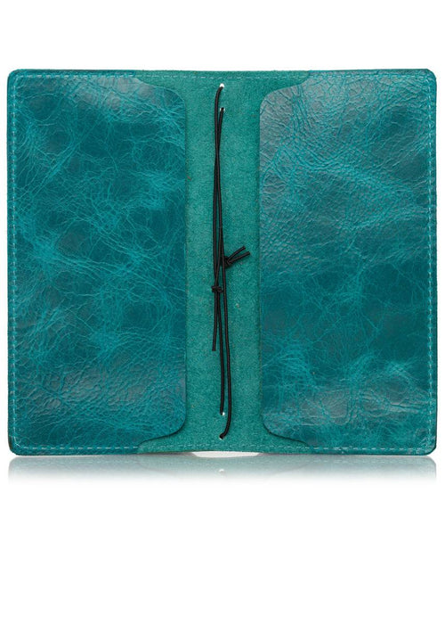 Blue leather notebook cover for Hobonichi Weeks planner. Inside pockets and string for inserts.