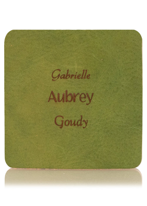 Green leather sample with inscription text. Choose from 3 different fonts to customize the leather notebook cover.