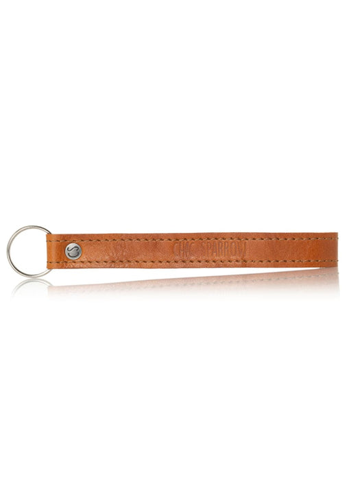 Tan Italian leather key fob with Chic Sparrow logo. Leather keychain fits around wrist.