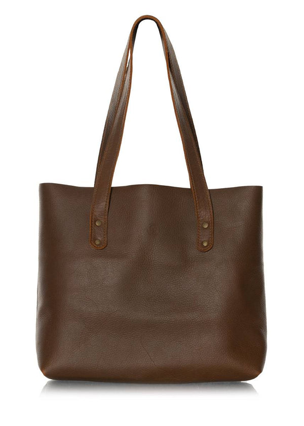 Brown leather tote bag. Simple leather handbag with outside pocket and handles.