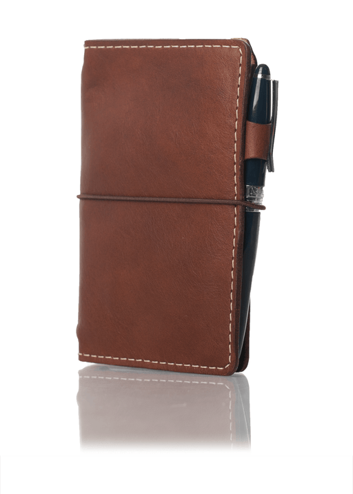 Brown leather travelers notebook cover. Brown leather journal cover with elastic closure.