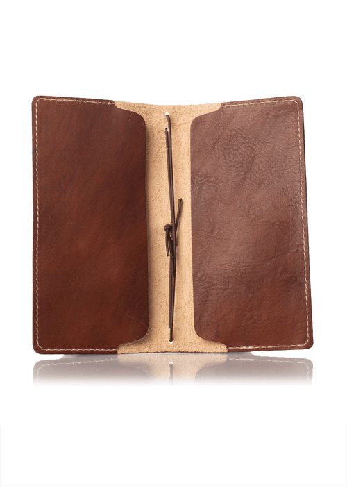 Brown leather notebook cover for Hobonichi Weeks planner. Front and back inside pockets.
