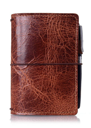 Brown leather travelers notebook cover. Brown leather journal cover with elastic closure.