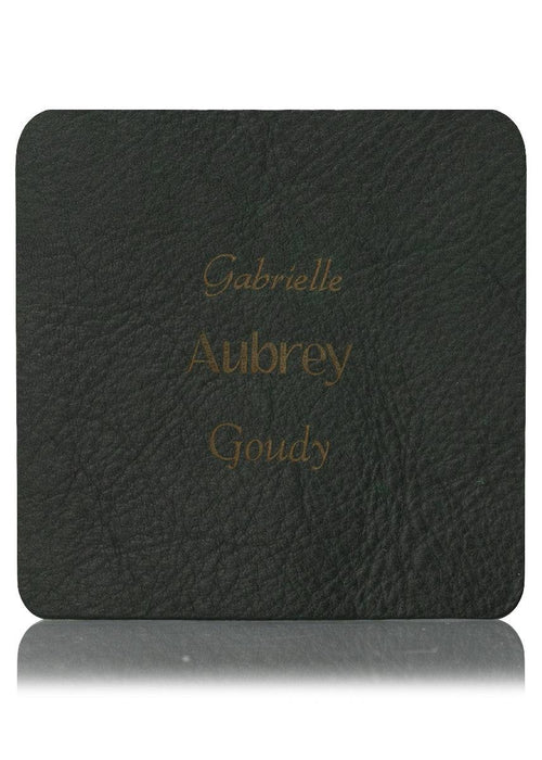 Green leather sample with inscription text. Choose from 3 different fonts to customize the product.