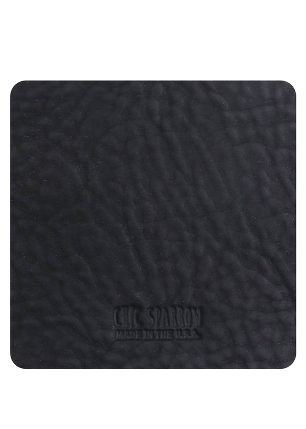 Black leather sample with Chic Sparrow logo. Square leather sample.
