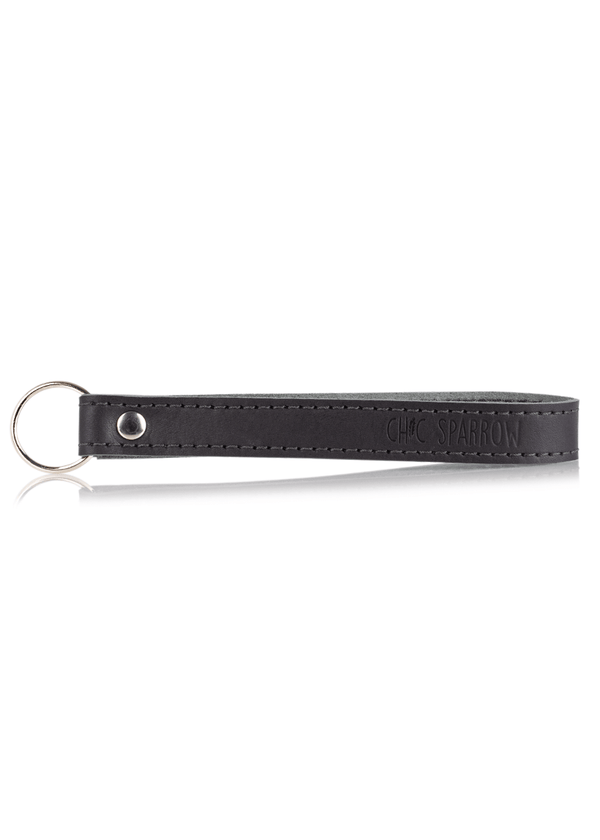 Black leather key fob with Chic Sparrow logo. Leather keychain with key ring and rivet.