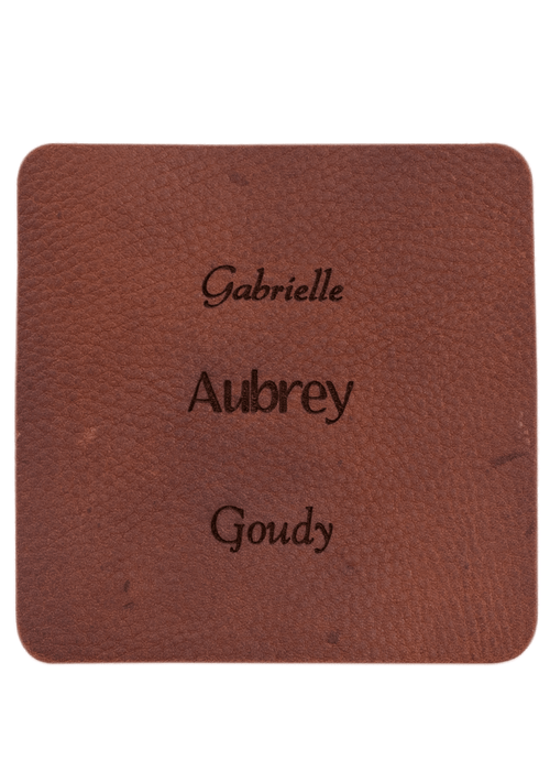 Brown leather sample with inscription text. Choose from 3 different fonts to customize the product.